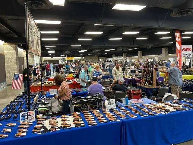 Crowded gun show vendor floor